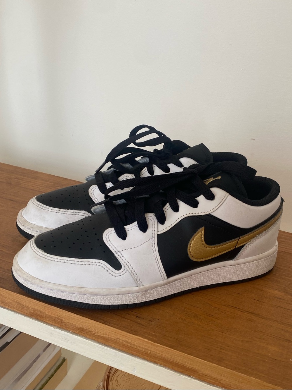 Nike Air Jordan 1 Low gold swoosh sneakers